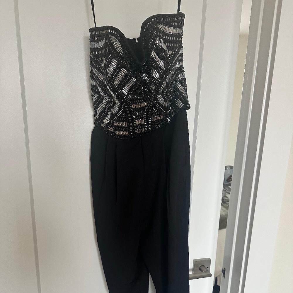 Women’s NWT black holiday/new years sparkly jumpsuit size S